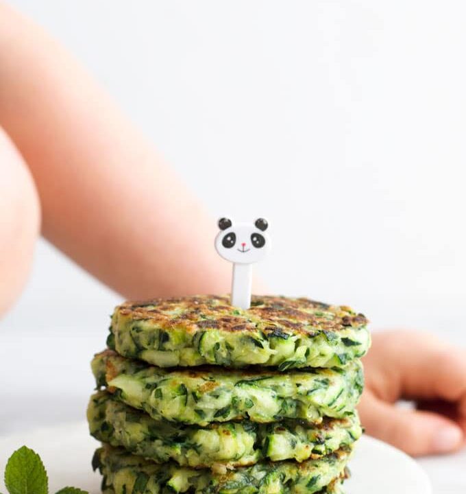 Stack of Zucchini Fritters with Kid Fork Pic on Top