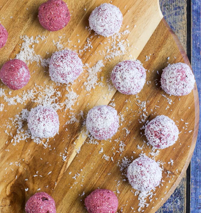 Raspberry Coconut Breakfast balls, sweetened only with fruit. A perfect hand held breakfast for young kids. No refined sugar or sweeteners.